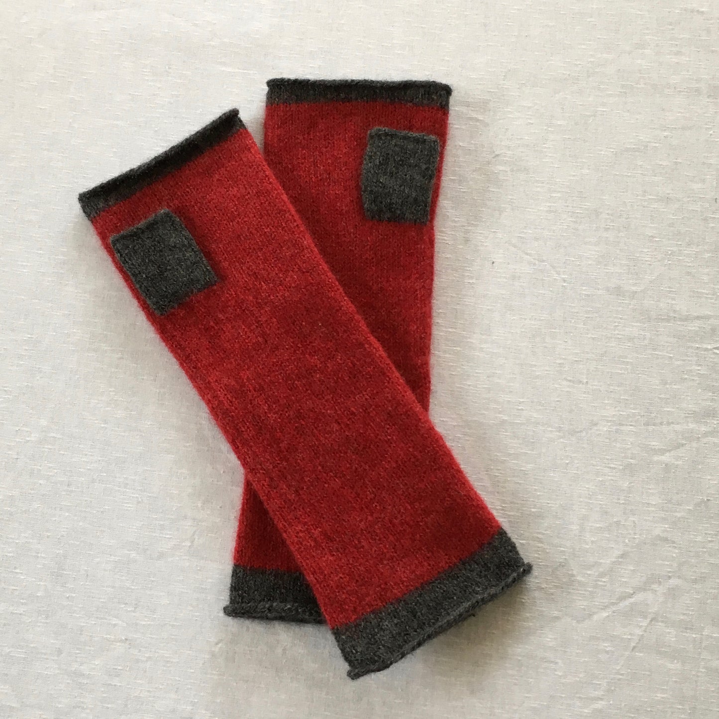 FinesseKnits, fingerless mittens berry red with coal grey ends and thump