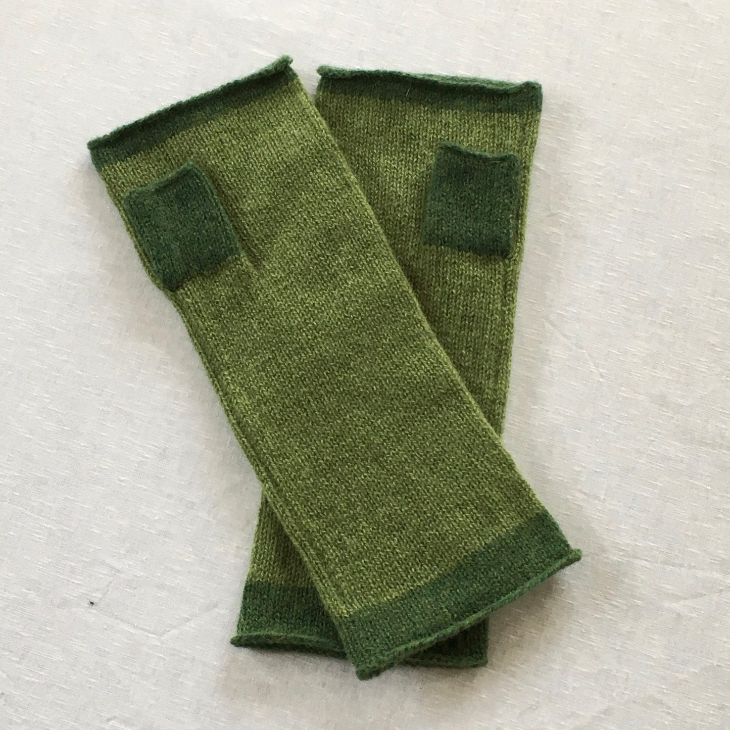 FinesseKnits, fingerless mittens bay green with turf green ends and thump