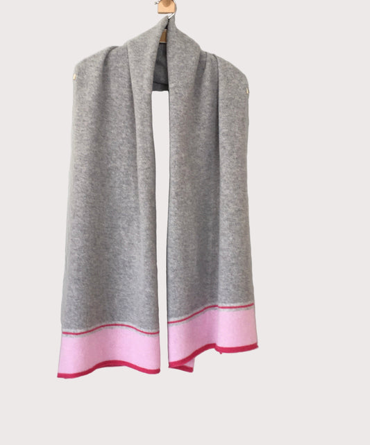 Gray scarf with pink hem on a light gray background