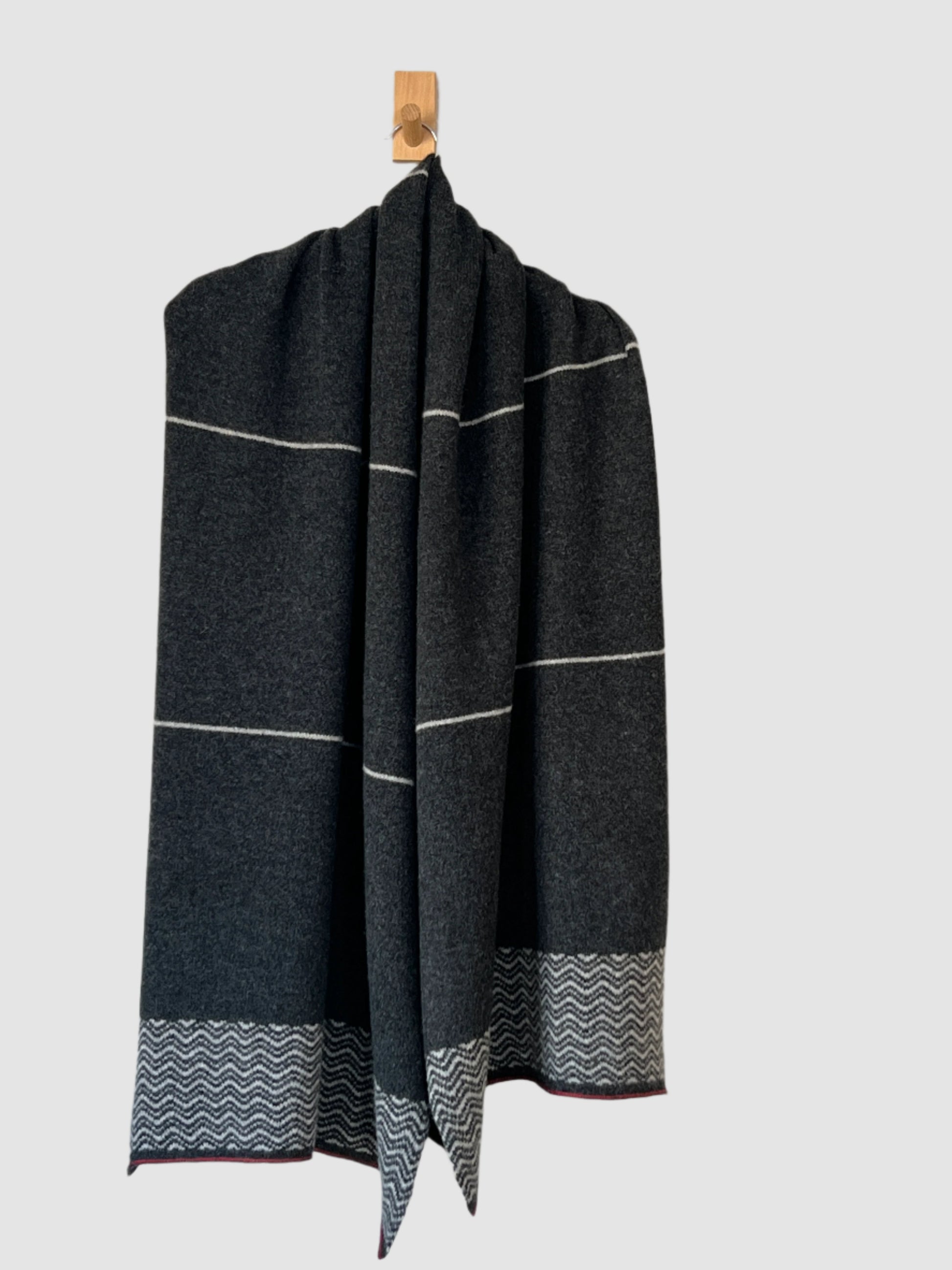 FinesseKnits This scarf/wrap/shawl is designed to keep you warm and stylish all year round. It is crafted with light and cozy fine merino lambswool, providing a snug and comfortable fit when worn over your shoulders or wrapped around you. Stay warm and stylish with this perfect shawl.