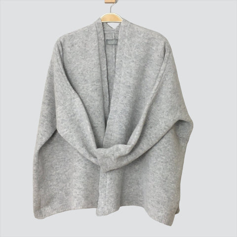 Made from soft, high-quality Merino lambswool, our edge-to-edge boxy style uniform grey cardigan is perfect for any occasion. No buttons for easy wear and a modern look Finesse Knits